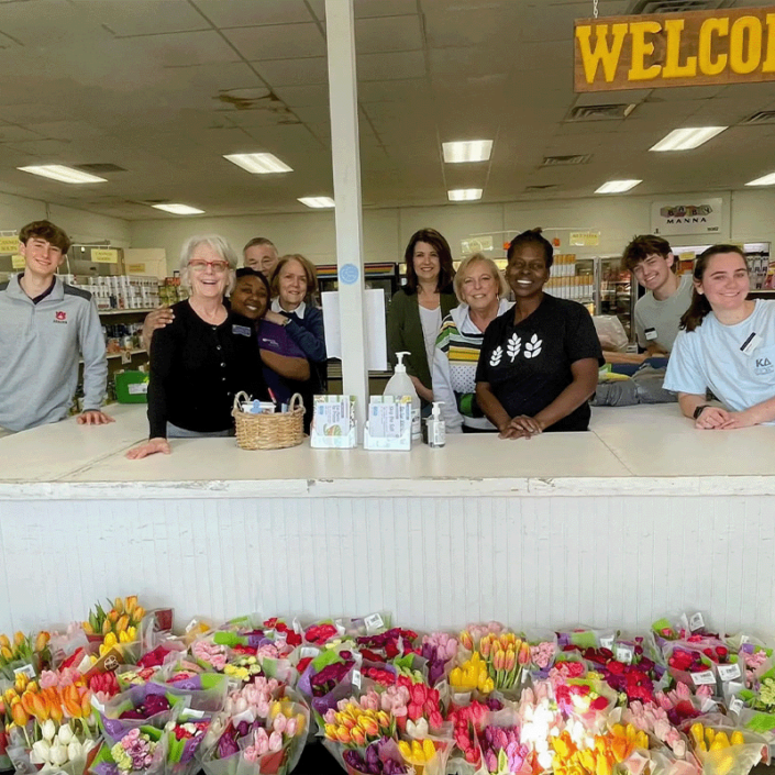 Volunteers assisting feed those in need at the Community Market of East Alabama